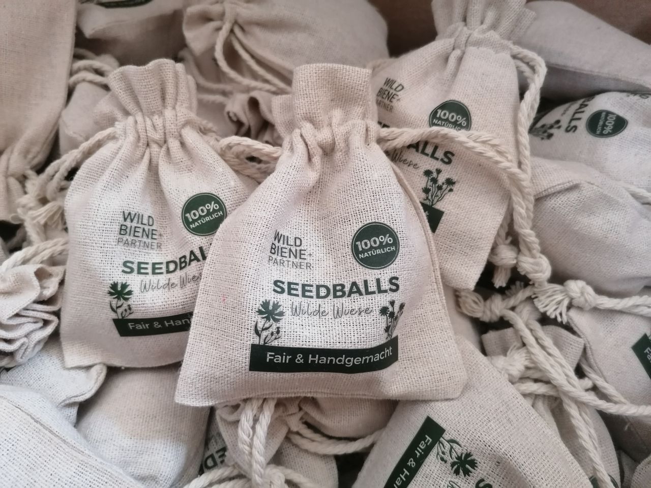Individuelle Seedball‑Give‑aways mit Firmenlogo